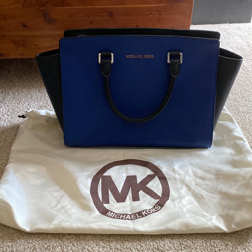 Blue Michael Kors bag.